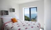 Bedroom 4 is on the second floor and also has a large picture window which you can open wide to breathe in that sea air or simply listen to the sounds of the seaside. - Thumbnail Image