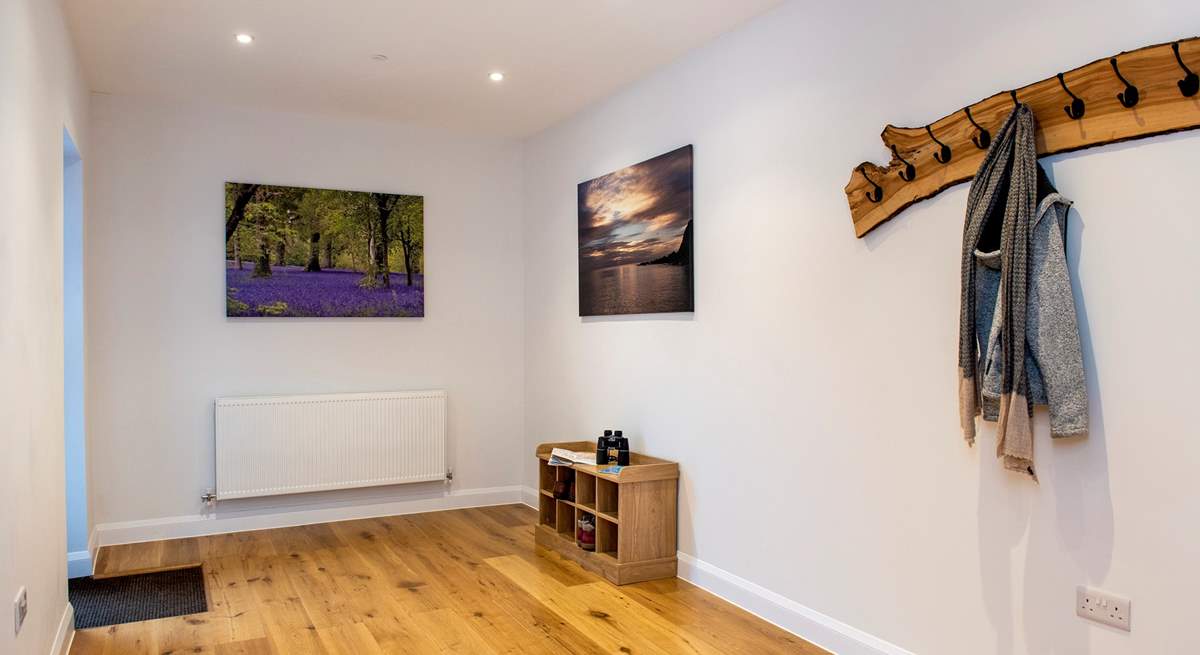 The large entrance hall provides a warm welcome and plenty of storage space