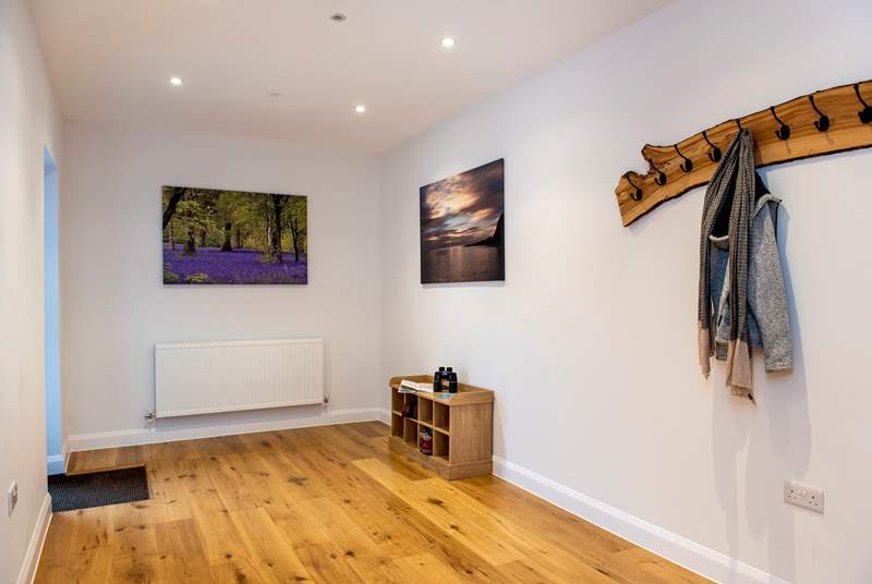 The large entrance hall provides a warm welcome and plenty of storage space