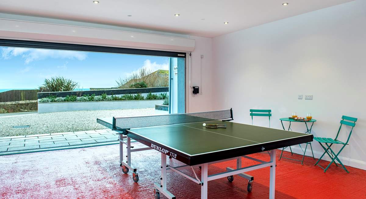 The garage doubles up as a games-room offering table-tennis and table-football, and of course if you open up the door you can still enjoy that view!