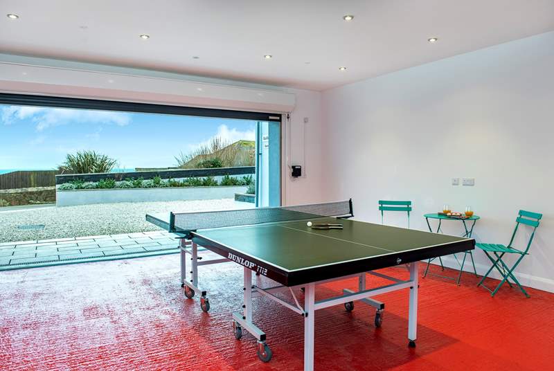 The garage doubles up as a games-room offering table-tennis and table-football, and of course if you open up the door you can still enjoy that view!