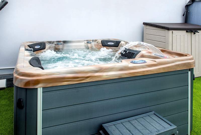 Relax on the terrace in your hot tub.