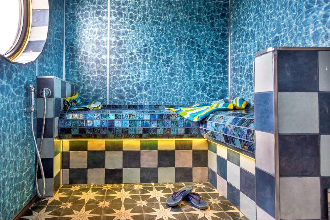 After a day at the beach, relax and unwind in the steam room.