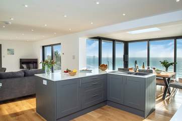 The sleek and modern kitchen complete with a stylish island.
