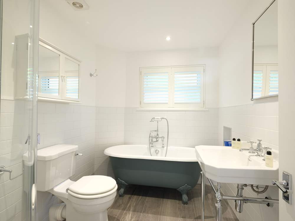 Relax in the roll-top bath.