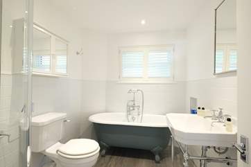 Relax in the roll-top bath.