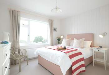 Bedroom 2 has a king-size double bed and views of the sea.