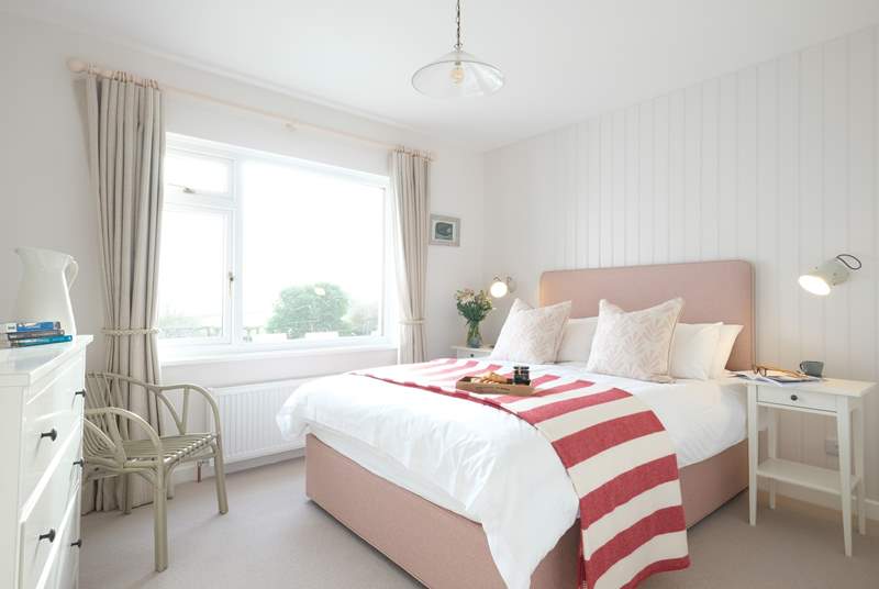 Bedroom 2 has a king-size double bed and views of the sea.