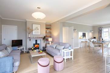 The stylish open plan sitting/dining-room.