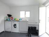 The utility-room in the garage has plenty of space for beach gear.