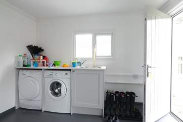 The utility-room in the garage has plenty of space for beach gear.