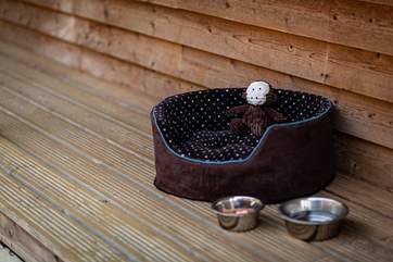 A cosy bed for the dog.