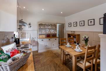 The well-equipped farmhouse-style kitchen and dining area.