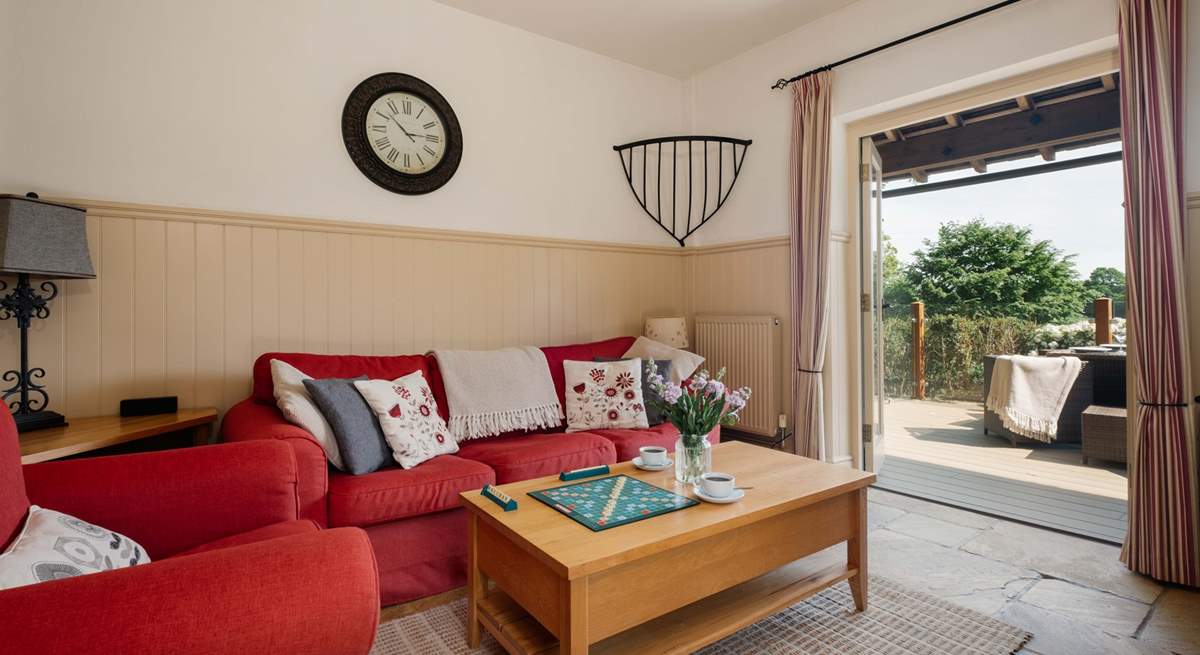 Double doors from the living area open to the private decking area.