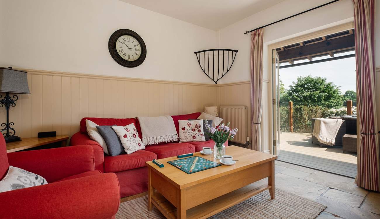 Double doors from the living area open to the private decking area.