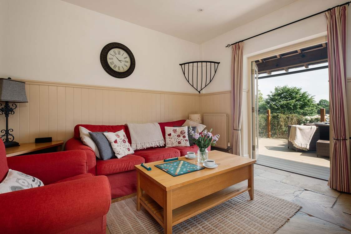 Double doors from the living area open to the private decking area.