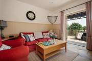 Double doors from the living area open to the private decking area.