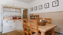 The well-equipped farmhouse-style kitchen and dining area.