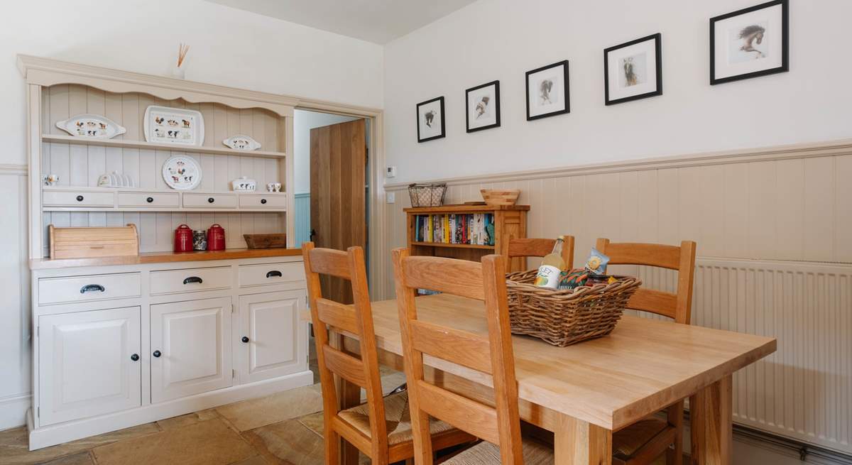 The well-equipped farmhouse-style kitchen and dining area.