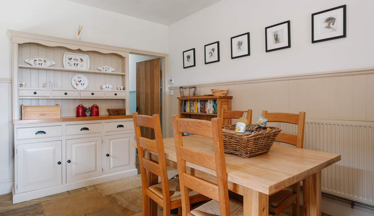 The well-equipped farmhouse-style kitchen and dining area.