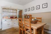 The well-equipped farmhouse-style kitchen and dining area.