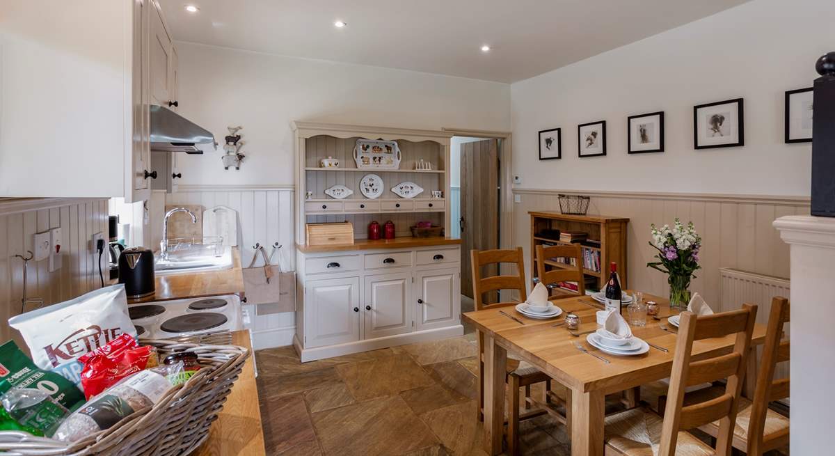 The well-equipped farmhouse-style kitchen and dining area.