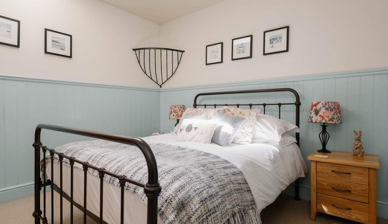 This dreamy double bedroom has an en suite shower room.