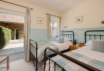 Doors open out onto the courtyard.