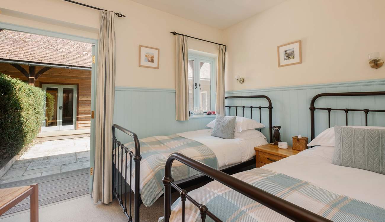 Doors open out onto the courtyard.