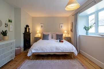 The master bedroom is exceptionally spacious and bright. The luxury feel is perfected by this glorious super-king size bed.