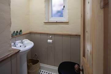 You will find the WC at the mid-point of stairs leading to the first floor.