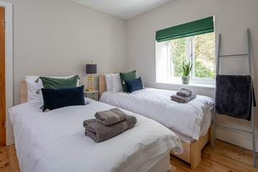 This beautiful king-size bed transforms into a rather inviting twin room offering extra sleeping flexibility.