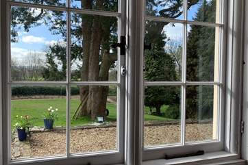 The large dining-room looks out over the side garden.