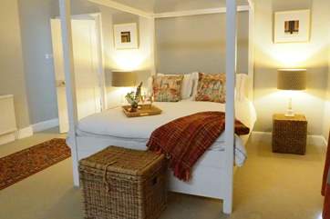 The second double en suite bedroom with grand four poster bed.