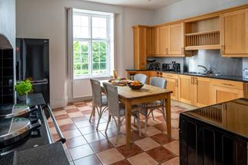 A view of the kitchen with the Aga and large fridge freezer, there is also a double range electric cooker in the kitchen/breakfast room.