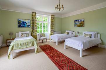 The lovely green bedroom (bedroom 3) with calming colours and views over the garden.