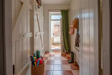 The rear hallway with space for coats, boots and umbrellas leads through to the enclosed gravelled courtyard, a perfect space for your four legged family member.