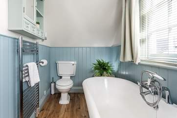 Enjoy a soak in the roll-top bath.