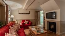 Cosy living space with feature fireplace.