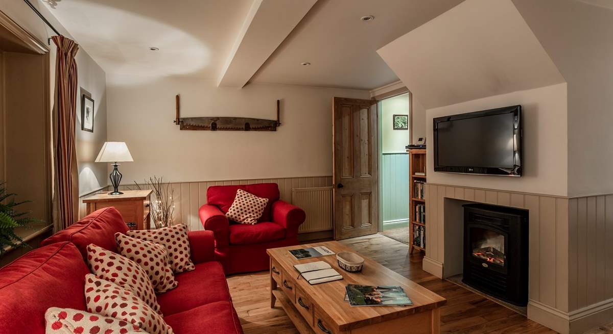 Cosy living space with feature fireplace.