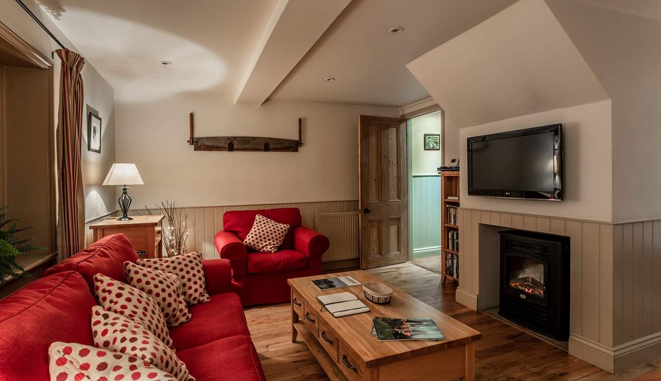 Cosy living space with feature fireplace.