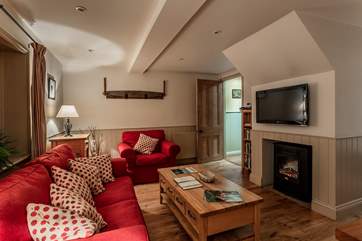 Cosy living space with feature fireplace.