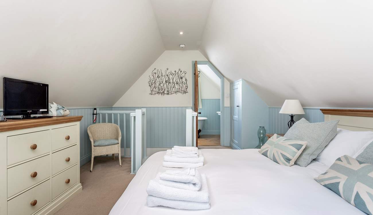 The bedroom leads onto the bathroom.