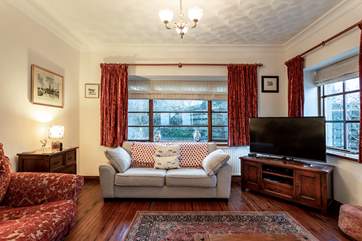 The spacious sitting-room with the added extra of a piano for a good old sing song.