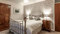Bedroom 1 has a king-size bed with magnificent sea views.