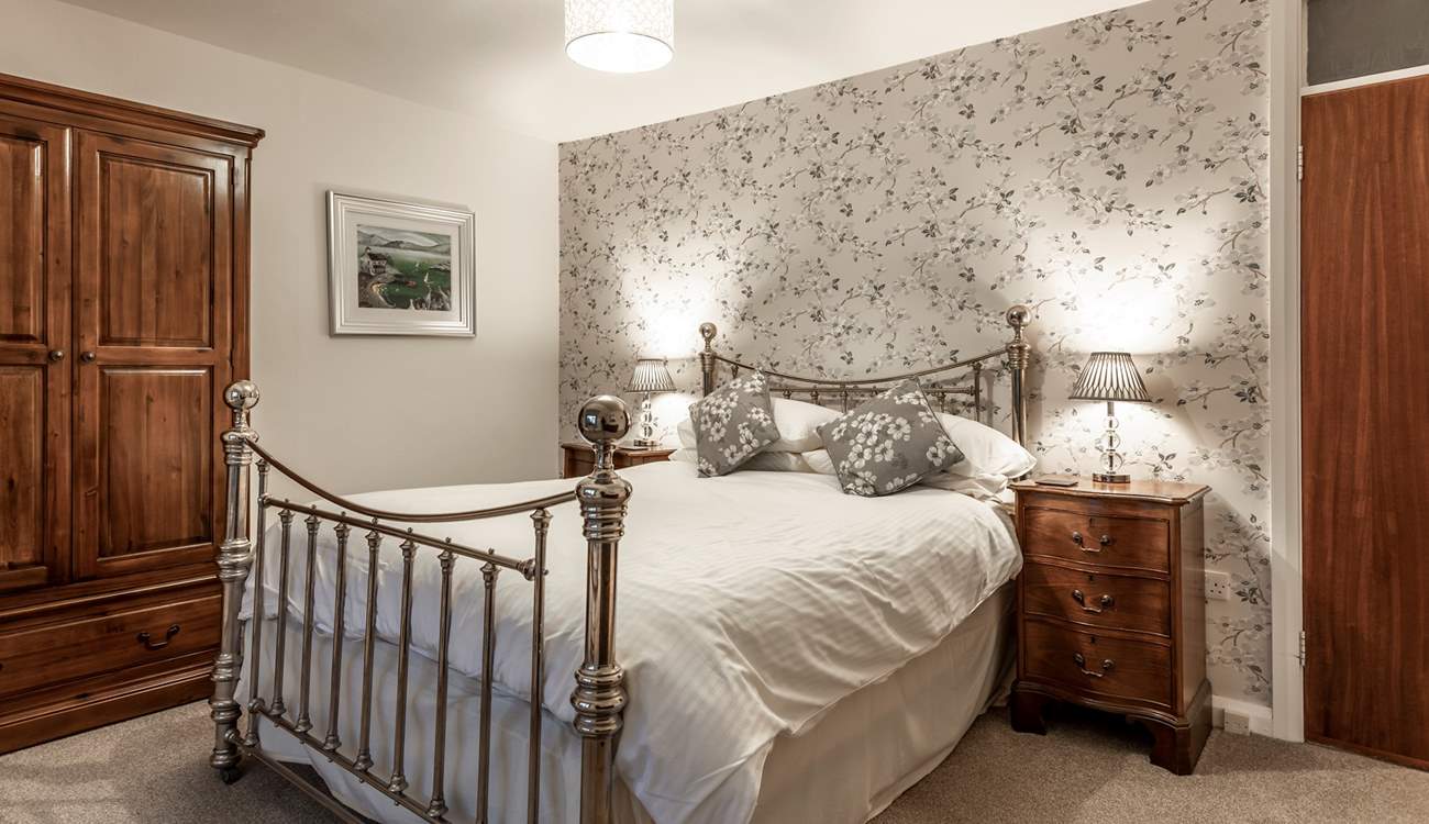 Bedroom 1 has a king-size bed with magnificent sea views.