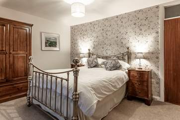 Bedroom 1 has a king-size bed with magnificent sea views.