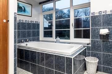 The family bathroom with bath and shower cubicle.