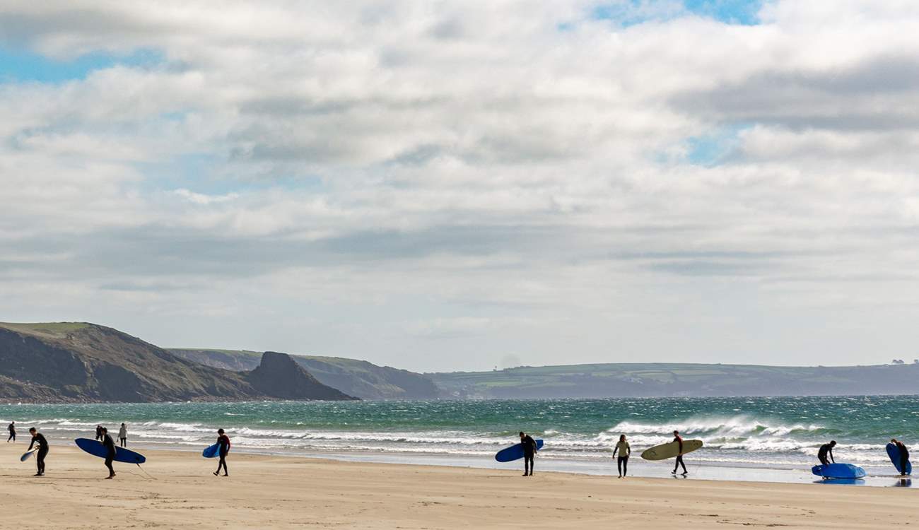 The rolling surf of Newgale is popular with surfers. 