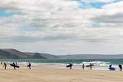 The rolling surf of Newgale is popular with surfers.